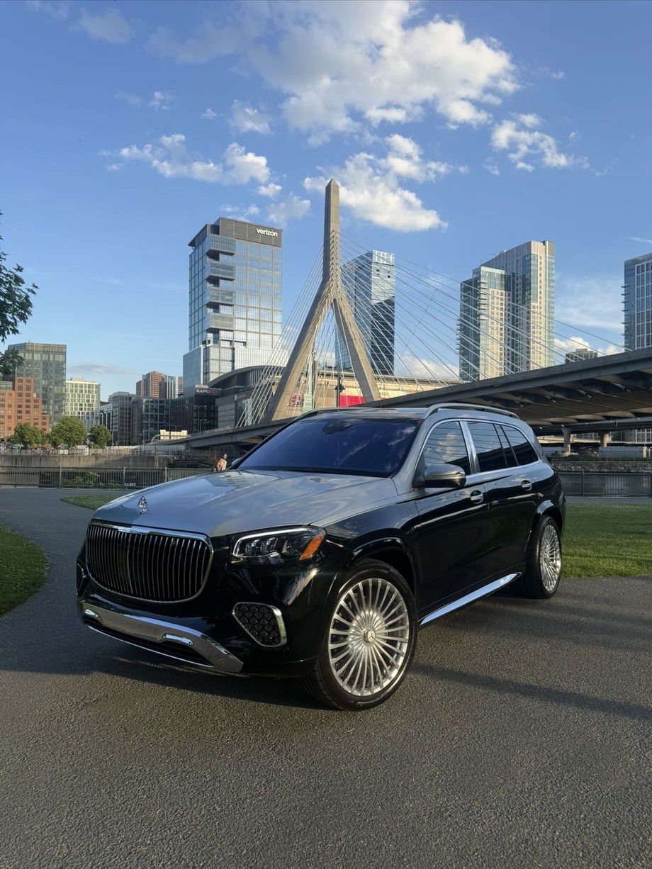 Black Mercedes-Maybach GLS parked in front of the Zakim Bridge in Boston